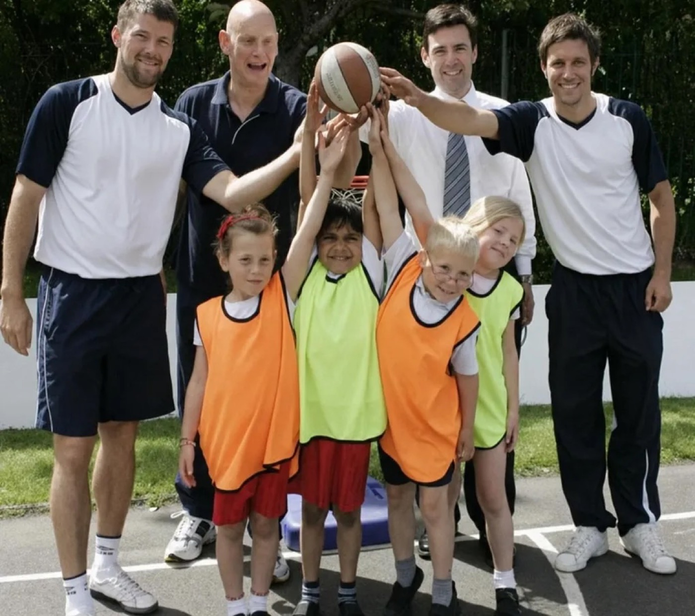 Andy and Danny delivering a school sport session with children